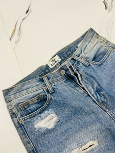 Distressed Blue Denim Jeans