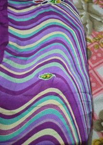 Vibrant Purple Striped Fabric with Floral Embellis