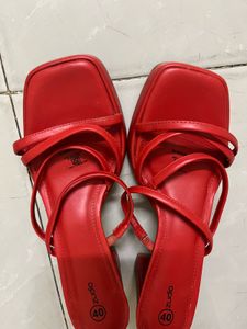Unused red heels