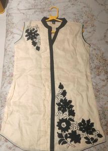 A contemporary short white kurta- no brand, worn o