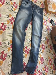Distressed Blue Denim Jeans
