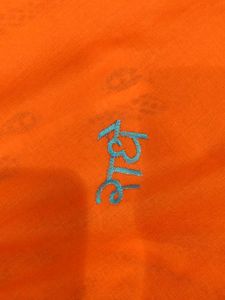 Orange Fabric with Peacock Feather Print (3 meter)