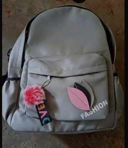 Stylish Grey Backpack with Pom-Pom