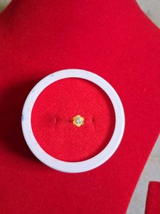 Gold Flower Nose Pin as earpressing