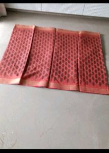 Beautiful Red Saree with Intricate Black Motifs