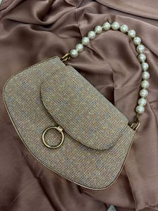 Shimmery Handbag with pearl chain