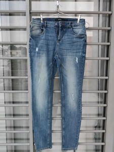 Distressed Blue Denim Jeans