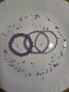 purple bracelet stack