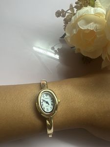 Elegant Gold Oval Bangle Watch