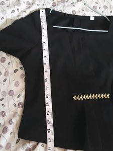 Elegant Black Peplum Top with Embellishments