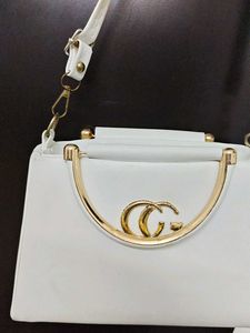 Chic White Handbag with Gold Accent