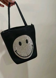 Rhinestone studded smiley face crossbody bag