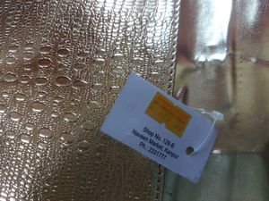 Beautiful golden Clutch with a bronze buckle
