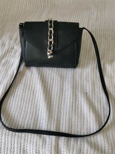 Chic Black Crossbody Bag with Chain Detail
