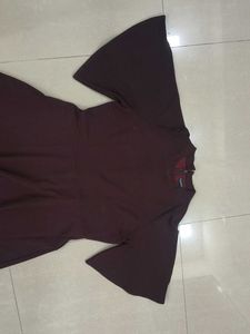 Women's Burgundy Bell Sleeve Dress with cut out.