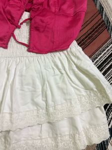 Chic Pink Lace-Up Crop Top with white skirt