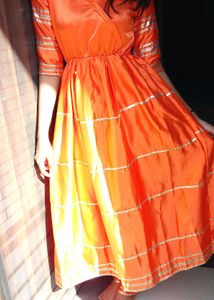 Vibrant Orange Kurta Set with Golden Accents