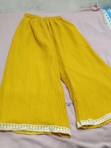 mustard colour plazo and off white top