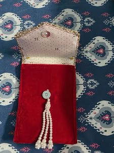 Embellished Clutch with Pearl Tassels
