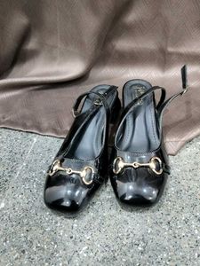 Chic Black Patent Heels with Gold Buckle