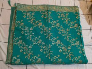Elegant Teal Saree with Gold Peacock Motif