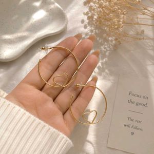 Gold Hoop Earrings with Heart Detail