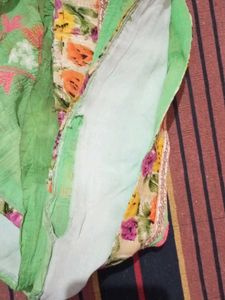 Beautiful Green Saree with Floral Embellishments