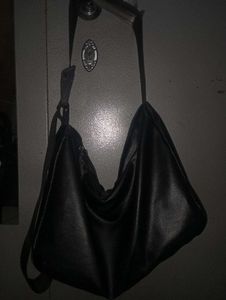 Black leather bag with adjustable strap