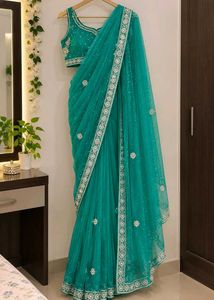 Stunning Teal Net Saree with Embellishments
