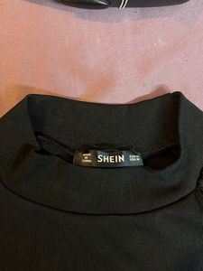 Chic Black Top with Sheer Sleeves