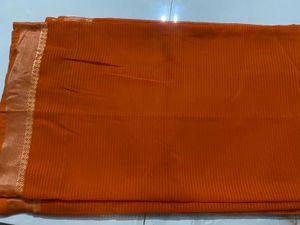 Elegant Orange Saree with Golden Border and  uns