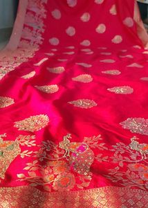 Vibrant Pink Saree with Peacock Motifs