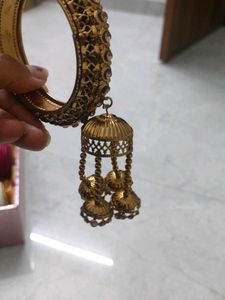 Elegant Gold Tone Bangle with Tassel