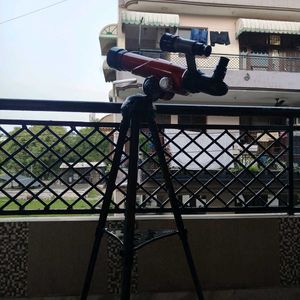Red Telescope with Tripod