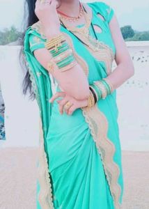 Elegant Teal Saree with Gold Border