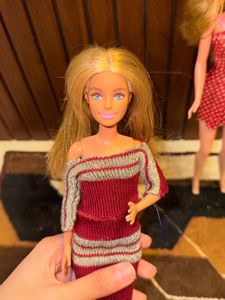 Two barbie dolls