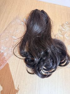 Hair extensions with attached claw