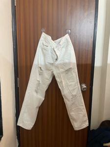 Cream Distressed Denim Jeans