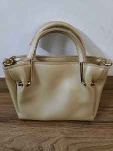 FOREVER YOUNG Beige Handbag with Pom Po