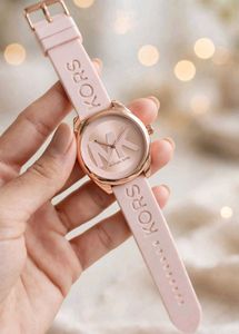 Michael Kors watch with a bold MK logo on the silv