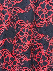 Black lacy dress with red floral detailing