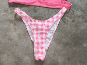 tri-bralette style bikini top and pink bot