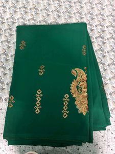 Elegant Emerald Green Saree with Gold Embellishmen