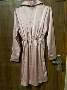 Imported satin finish twist front dress.