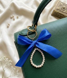 Elegant Pearl & Bow Keychain Charm