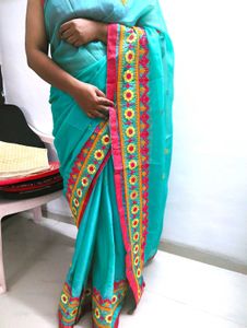 Beautiful Teal Saree with Pink Border
