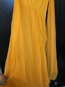 Beautiful Yellow Partywear Gown With Net Pallu