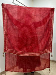Red lehenga with matching dupatta and golden blous