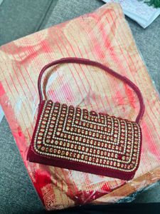 Red Embroidered saree and Blouse with Handbag