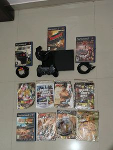 PS2 Console With 11 CD's (Non Working)